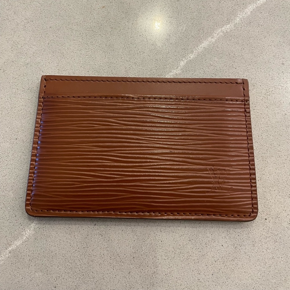 Louis Vuitton epi brown card case with orange interior